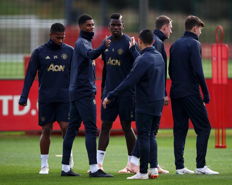 Marcus Rashford and Alexis Sanchez greet each other as Pogba looks on. Getty Images