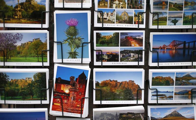 Postcards are displayed outside a shop along the Royal Mile in Edinburgh, Scotland. The contrast between the capital and Kilmarnock is startling and highlights the wide social divide among Scots ahead of a September 18 referendum when Scottish residents will decide whether to leave the United Kingdom after more than 300 years to become an independent country. Suzanne Plunkett / Reuters