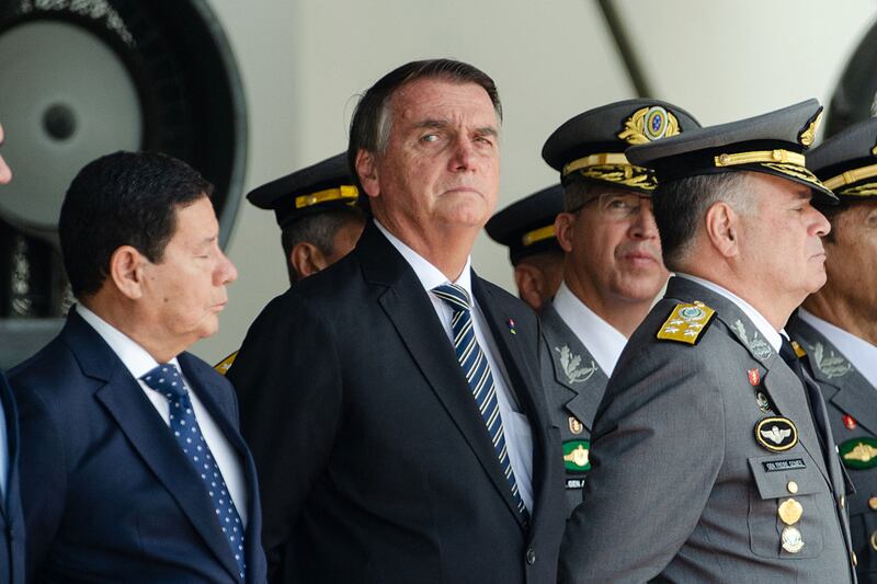 Brazilian President Jair Bolsonaro (C), Vice President Hamilton Mourao (L) and Commander of the Army General Marco Antonio Freire Gomes attend a graduation ceremony for cadets at the Agulhas Negras Military Academy in Resende, Brazil. AFP.