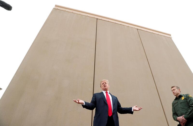 US President Donald Trump speaks while participating in a tour of US-Mexico border wall prototypes near the Otay Mesa Port of Entry in San Diego, California, on March 13, 2018. Reuters