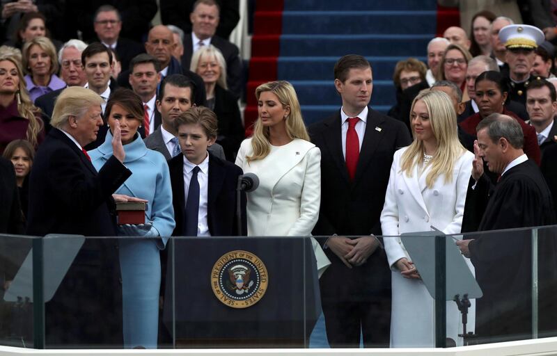U.S. President Donald Trump (L) takes the oath of office from U.S. Supreme Court Chief Justice John Roberts (R) with his wife Melania, and children Barron, Donald, Ivanka and Tiffany at his side during inauguration ceremonies at the Capitol in Washington, U.S.,  January 20, 2017. REUTERS/Carlos Barria      TPX IMAGES OF THE DAY