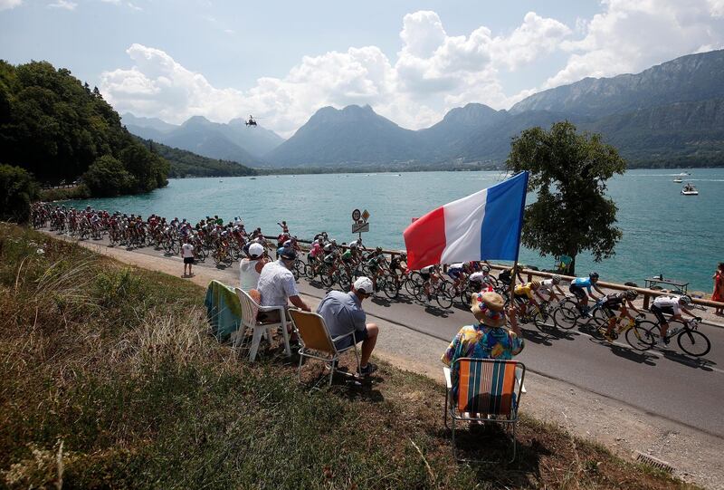 Cyclists in action next to Annecy Lake during the 10th stage of the Tour de France over 158,5km between Annecy and Le Grand-Bornand. Yoan Valat / EPA