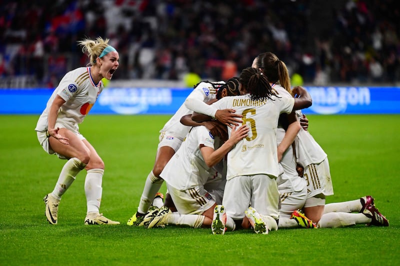 Lyon's French midfielder Melchie Dumornay celebrates with teammates on their way to a 3-2 victory in the Uefa Women's Champions League semi-final first leg over Paris Saint-Germain at the Parc Olympique Lyonnais stadium in Decines-Charpieu, central-eastern France. AFP