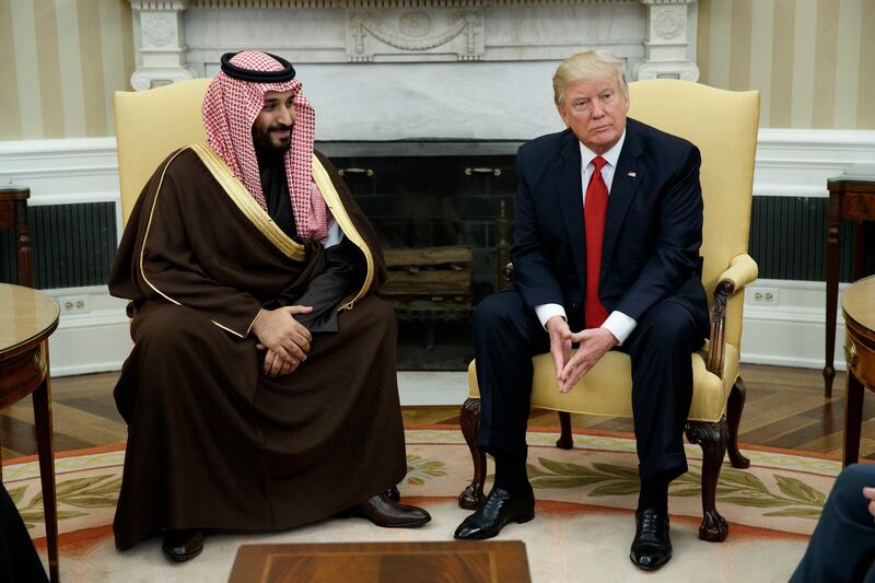 FILE - In this March 14, 2017, file photo, President Donald Trump meets with Saudi Defense Minister and Deputy Crown Prince Mohammed bin Salman in the Oval Office of the White House in Washington.  Trump wants to bring feuding Persian Gulf leaders to Camp David for a show of solidarity with the United States. But there are strings attached: No breakthrough in the Qatar crisis, no Camp David. A potential summit of the six-country Gulf Cooperation Council in May at the prestigious presidential retreat in Marylandâ€™s Catoctin Mountains will be scuttled unless Qatar and neighbors Saudi Arabia, the United Arab Emirates and Bahrain are on track to resolve the nearly year-long spat. A pair of Trump administration emissaries will deliver the message next week as they crisscross the Gulf in a renewed bid to try to end the crisis. The Saudi crown prince is expected to visit Washington in mid-March. (AP Photo/Evan Vucci, File)