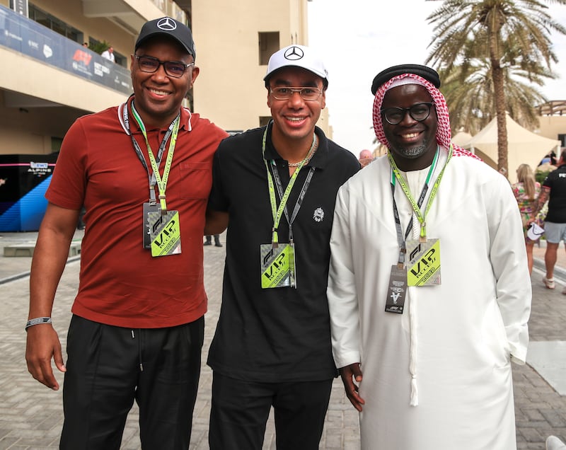 Antonio Silva, Adrian Lee-chin and Rogers Sithole on championship day behind the Pit Lane Walk at the Yas Marina Circuit in Abu Dhabi. Victor Besa / The National
