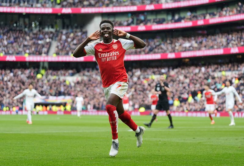 Arsenal's Bukayo Saka celebrates after scoring his side's second goal. PA 