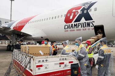 epa08338931 A handout photo made available by the New England Patriots' team shows workers loading more than one million N95 masks into the New England Patriots team plane in Shenzhnen, China, 02 April 2020. According to media reports, quaratine rules were lifted for the crew on the condition they remain on the plane and the plane only stayed for a few hours during the loading before heading back to Boston, Massachusetts, USA where it will land later in the day on 02 April 2020. EPA/NEW ENGLAND PATRIOTS HANDOUT HANDOUT EDITORIAL USE ONLY/NO SALES