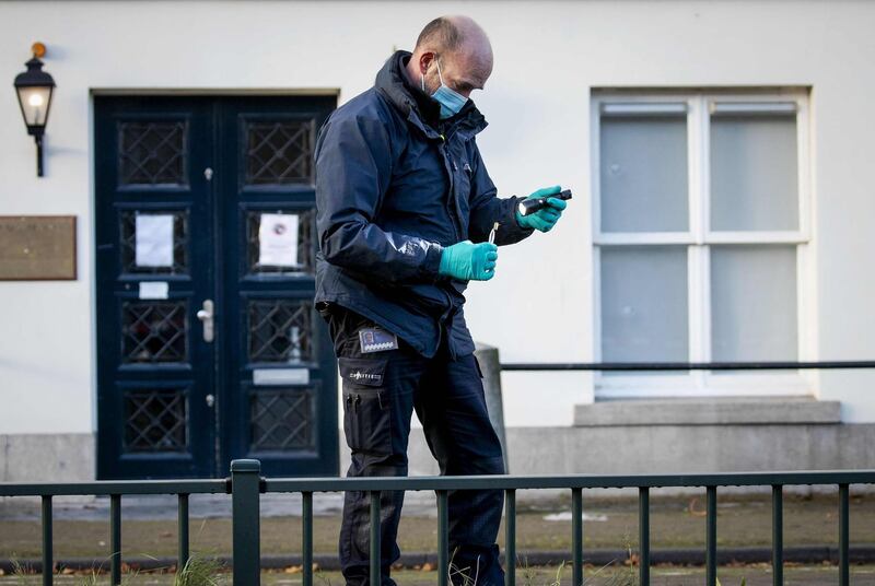 Forensics police officers investigate the Embassy of Saudi Arabia in The Hague after it was shot. AFP, ANP