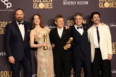 From left: Yorgos Lanthimos, Emma Stone, Willem Dafoe, Mark Ruffalo and Ramy Youssef pose with the award for Best Motion Picture - Musical or Comedy award for Poor Things. Reuters