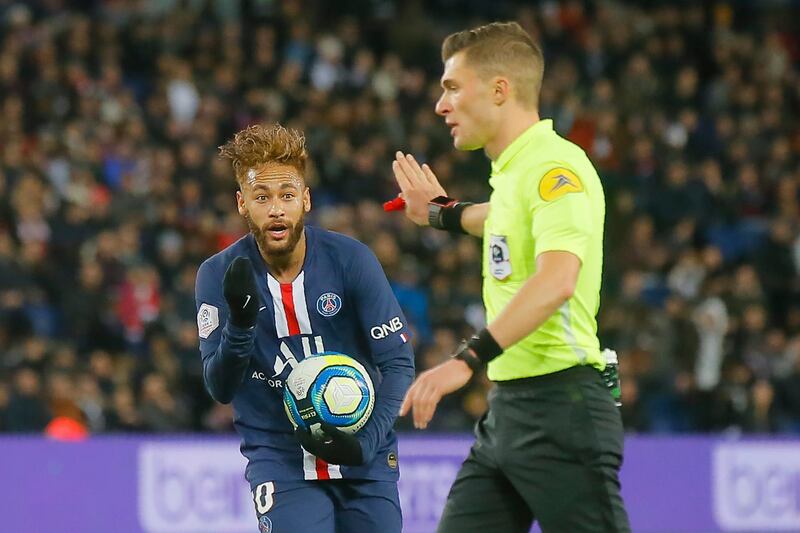 PSG's Neymar gestures to referee Willy Delajod. AP