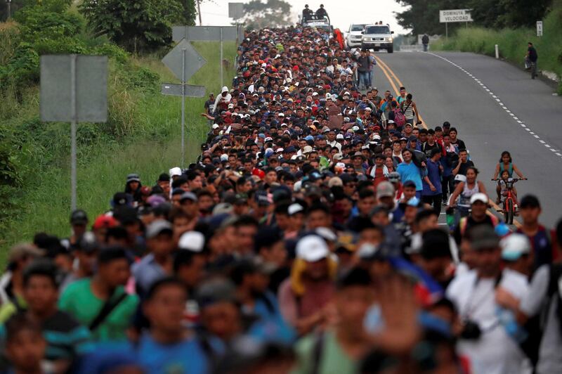 Migrants walk by the road that links Ciudad Hidalgo with Tapachula, Mexico. Reuters