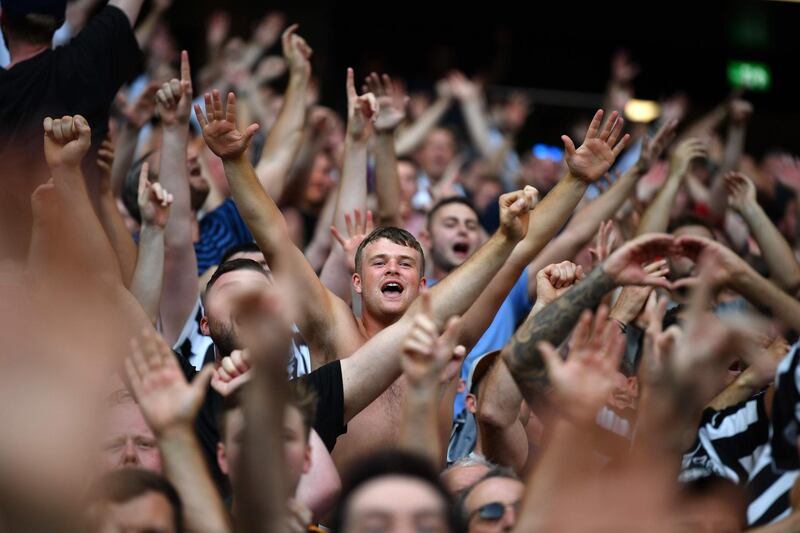 Newcastle supporters celebrate their team's victory over Tottenham. AFP