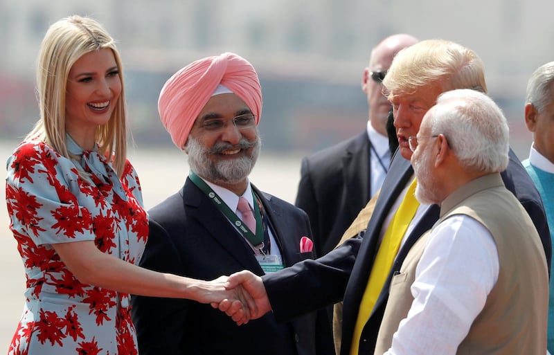 U.S. President Donald Trump greets U.S. White House senior advisor Ivanka Trump next to Indian Prime Minister Narendra Modi as they arrive at Sardar Vallabhbhai Patel International Airport in Ahmedabad. REUTERS