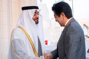 Sheikh Mohamed bin Zayed, Crown Prince of Abu Dhabi and Deputy Supreme Commander of the UAE Armed Forces, welcomes Shinzo Abe, Prime Minister of Japan, to Qasr Al Watan in the country's capital on Monday. Courtesy Sheikh Mohamed bin Zayed Twitter