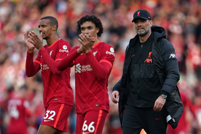 Jurgen Klopp, Trent Alexander-Arnold and Joel Matip celebrate after the match. AP