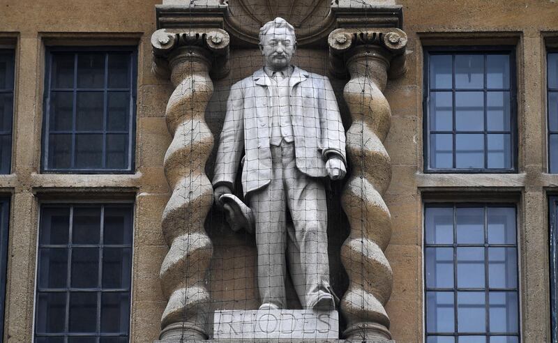 epa08480973 The Cecil Rhodes statue on the facade of the Oriel College in Oxford, Britain, 12 June 2020.  Protesters are calling for the removal of the statue of the British 19th century imperialist and politician. Media reports quoted the campaigners as saying the '19th century businessman and politician in southern Africa, represented white supremacy and was steeped in colonialism and racism'.  EPA/ANDY RAIN