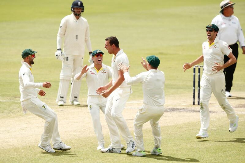PERTH, AUSTRALIA - DECEMBER 17:  Josh Hazlewood of Australia is congratulated by team mates after taking a catch off his bowling to dismiss Alistair Cook of England during day four of the Third Test match during the 2017/18 Ashes Series between Australia and England at WACA on December 17, 2017 in Perth, Australia.  (Photo by Paul Kane/Getty Images)