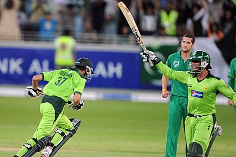 Zulqarnain Haider, left, and Shoaib Akhtar celebrate their win over South Africa in Dubai last night.