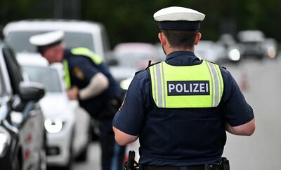 Police officers stop cars at a checkpoint near Garmisch-Partenkirchen in southern Germany, ahead of the start of the G7 Summit in Elmau. AFP