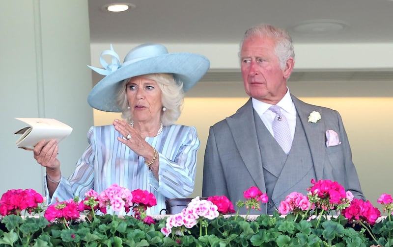 Camilla, Duchess of Cornwall and Prince Charles, Prince of Wales watch racing from the Royal Box during Royal Ascot 2021 at Ascot Racecourse on June 15, 2021 in Ascot, England. Getty Images