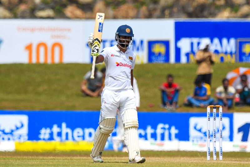 Sri Lanka captain Dimuth Karunaratne celebrates reaching his half-century. AFP