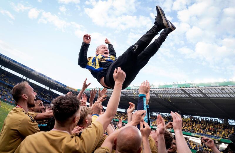 Brondby manager Niels Frederiksen is thrown in the air by his players after beating Nordsjaelland to win the Danish Superliga at Brondby Stadion on Monday, May 24. Reuters