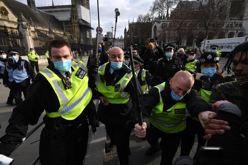 Police push back protesters during a 'Kill The Bill' demonstration outside the Houses of Parliament in London, UK. Getty Images
