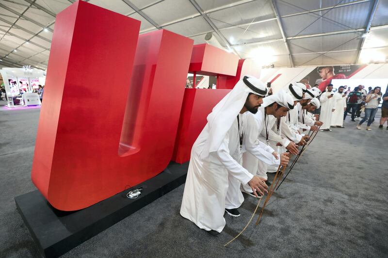 Abu Dhabi, United Arab Emirates - September 06, 2019: Emirati dancers at the UFC fan zone. Friday the 6th of September 2019. Yes Island, Abu Dhabi. Chris Whiteoak / The National