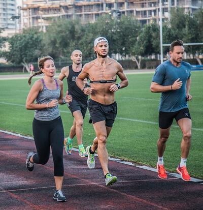 Dubai athlete Marcus Smith (centre) has challenged himself to running feats, including 30 marathons in 30 days and 24 hours of running. Courtesy Marcus Smith 