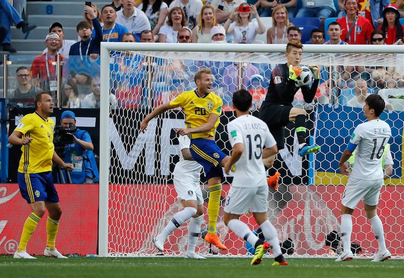 South Korea goalkeeper Jo Hyun-woo claims the ball. Pavel Golovkin / AP Photo