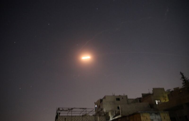 Syrian air defences try to intercept missiles over Damascus on Thursday night. EPA