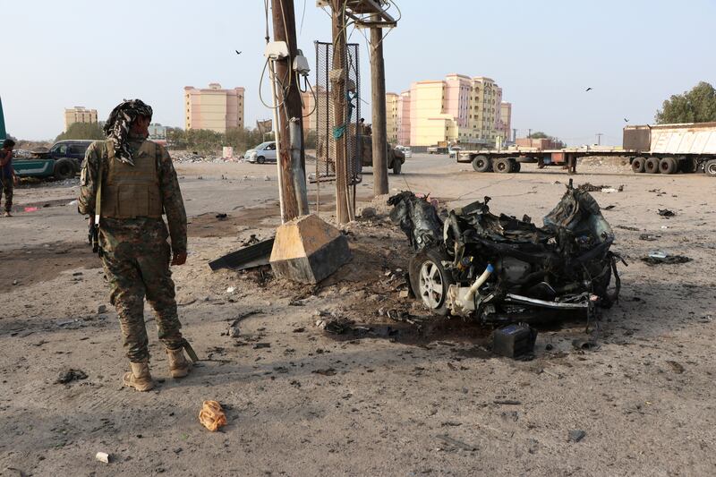 The wreckage at the site of a previous deadly car bomb attack in the port city of Aden, Yemen, in March. AP