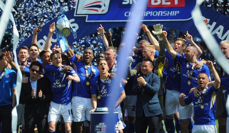 Wes Morgan of Leicester City lifts the Championship trophy after the match against Doncaster Rovers. Michael Regan / Getty Images
