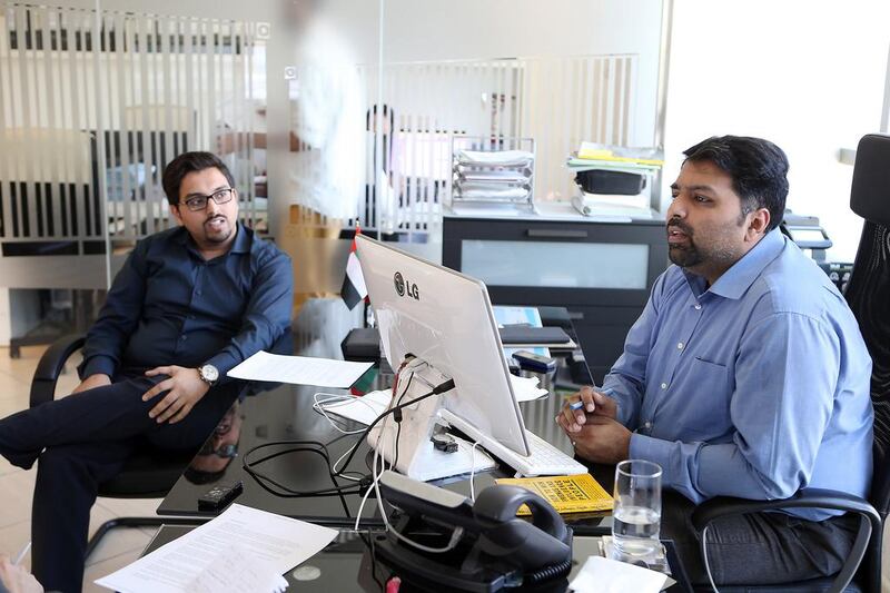 The Rafiq brothers Atif, left, and Kash have been investing in IT infrastructure in their family-owned firm to digitise most activities and provide customers with real-time information over deliveries. Pawan Singh / The National