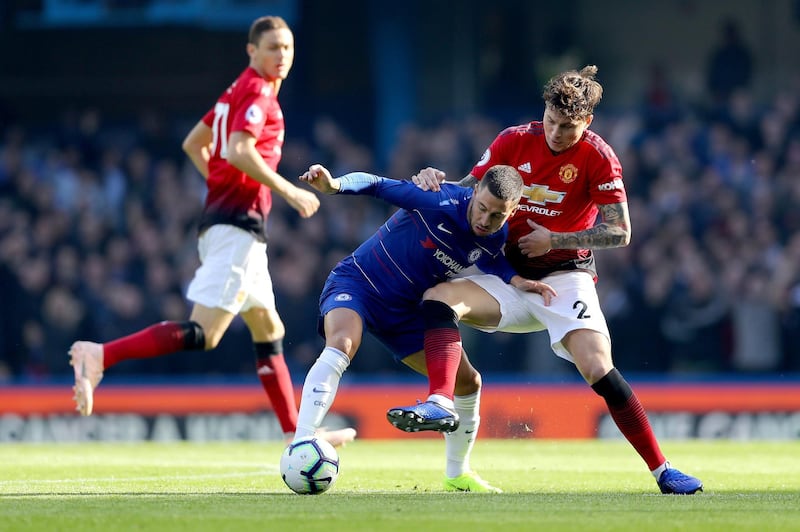 LONDON, ENGLAND - OCTOBER 20:  Eden Hazard of Chelsea is challenged by Victor Lindelof of Manchester United during the Premier League match between Chelsea FC and Manchester United at Stamford Bridge on October 20, 2018 in London, United Kingdom.  (Photo by Clive Rose/Getty Images)