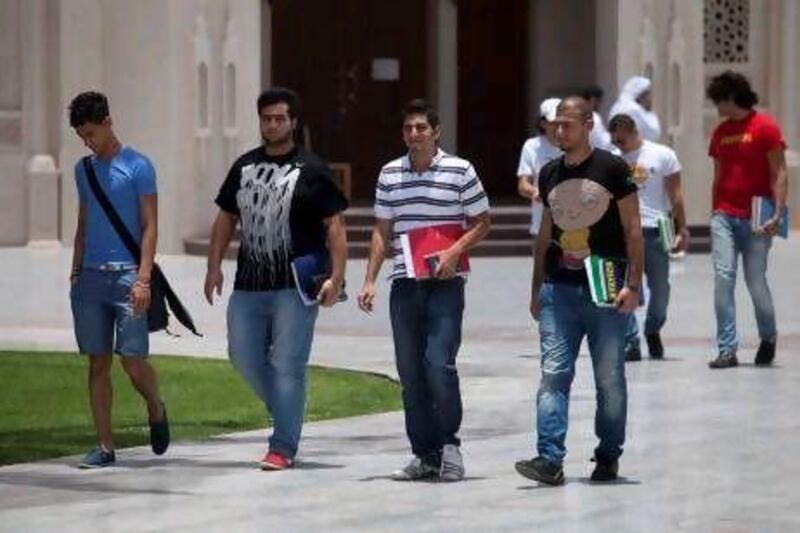 Students at the American University of Sharjah, which is urging prospective students to enrol before they receive their final results. Razan Alzayani / The National