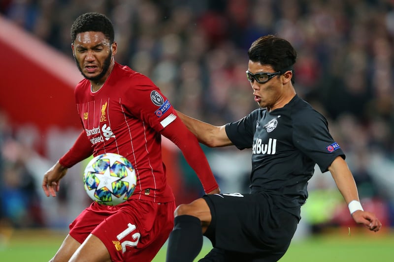 LIVERPOOL, ENGLAND - OCTOBER 02: Joe Gomez of Liverpool and Hwang Hee-chan of Red Bull Salzburg during the UEFA Champions League group E match between Liverpool FC and RB Salzburg at Anfield on October 02, 2019 in Liverpool, United Kingdom. (Photo by Alex Livesey/Getty Images)