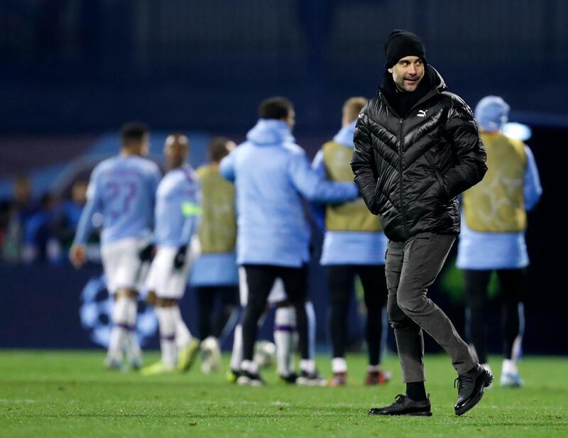 Manchester City coach Pep Guardiola smiles at the end of the Champions League qualifying game. AP