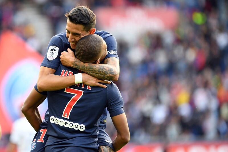Mbappe is congratulated by Angel Di Maria. AFP