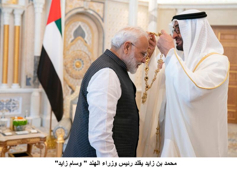 ABU DHABI, UNITED ARAB EMIRATES - August 24, 2019: HH Sheikh Mohamed bin Zayed Al Nahyan, Crown Prince of Abu Dhabi and Deputy Supreme Commander of the UAE Armed Forces (R), presents a Zayed Medal to HE Narendra Modi, Prime Minister of India (L), during a reception at Qasr Al Watan.

( Hamad Al Kaabi / Ministry of Presidential Affairs )​
---