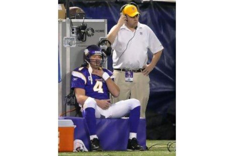 Brett Favre watches from the sidelines after being injured by a tackle on Sunday.