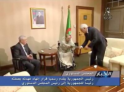 Algerian President AbdelazizÊBouteflika hands over resignation letter to constitutional council head Tayeb Belaiz as upper house chairman Abdelkader Bensalah (L) looks on, in Algeria, April 2, 2019, in this still image from Algerian State TV video. Algerian State TV/Handout via REUTERS  ATTENTION EDITORS - THIS IMAGE WAS PROVIDED BY A THIRD PARTY NO RESALES. NO ARCHIVE. NO ACCESS ALGERIA. ALGERIA OUT. NO COMMERCIAL OR EDITORIAL SALES IN ALGERIA. NO ACCESS ALGERIA.