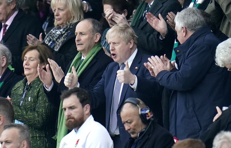 Irish Prime Minister Michael Martin and British Prime Minister Boris Johnson watch a Six Nations rugby match at Twickenham Stadium, London, on Saturday. PA Images