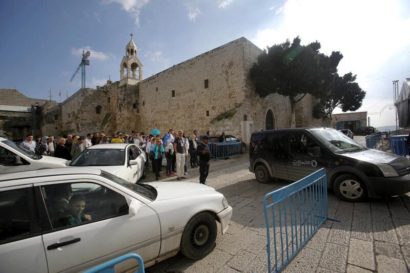 Drivers try not to crash into other cars as they crawl past the Church of the Nativity in Bethlehem on December 14, 2014. Nasser Shiyoukhi/AP Photo