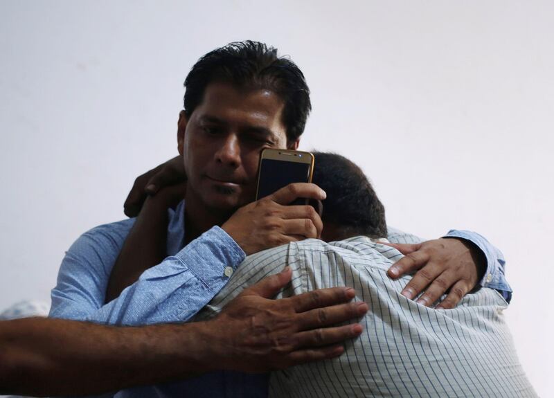 Aziz Shaikh (L), father of Sabika Aziz Sheikh, a Pakistani exchange student, who was killed with others when a gunman attacked Santa Fe High School in Santa Fe, Texas, U.S., is comforted by a relative at his residence in Karachi, Pakistan May 19, 2018. REUTERS/Akhtar Soomro