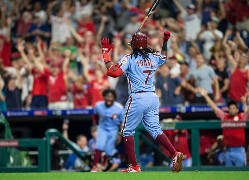 Philadelphia Phillies' Maikel Franco throws his bat and runs the bases after hitting a home run against the Miami Marlins. AP Photo