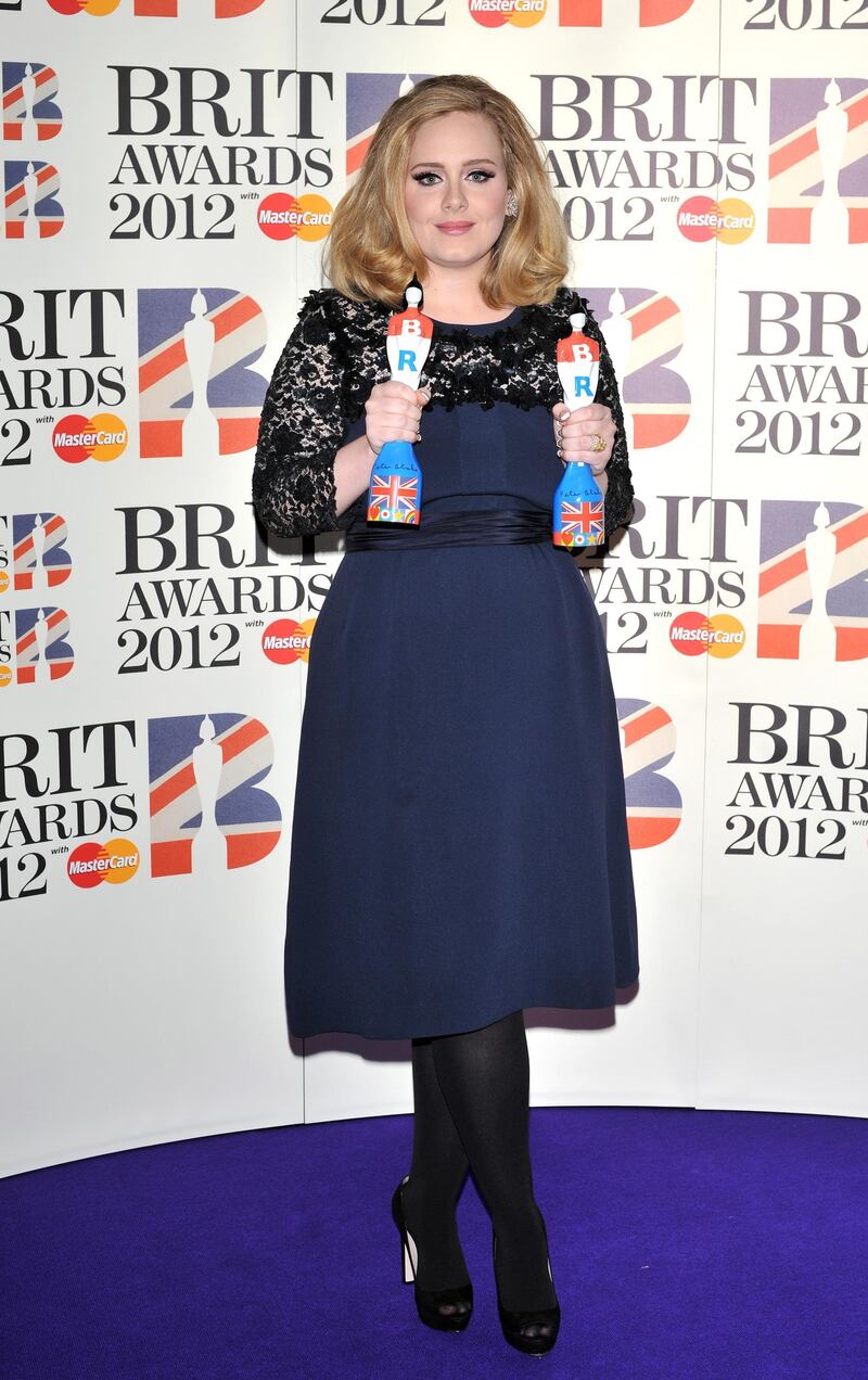 epa03115763 British singer Adele poses with her Best Album and Best British Female awards at the 2012 BRIT Awards held at the O2 Arena in London, Britain, 21 February 2012.  EPA/DANIEL DEME