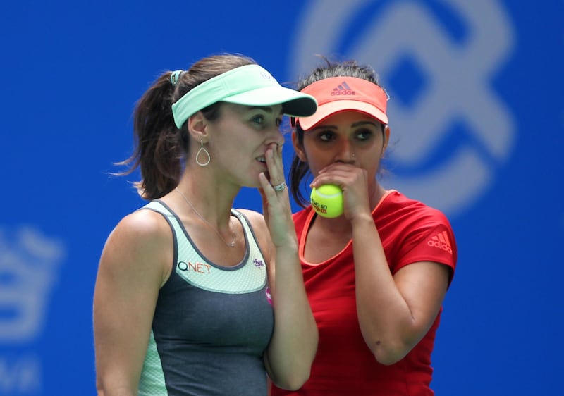 WUHAN, CHINA - OCTOBER 3: Martina Hingis of Switzerland discusses with Sania Mirza of India during the doubles final against Irina-Camelia Begu of Romania and Monica Niculescu of Romania on Day 7 of 2015 Dongfeng Motor Wuhan Open at Optics Valley International Tennis Center on October 3, 2015 in Wuhan, China. (Photo by Zhong Zhi/Getty Images)