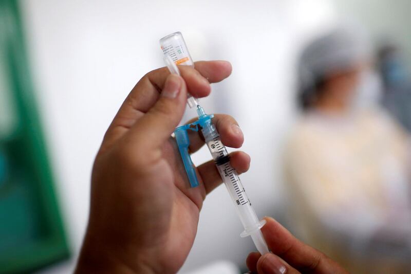 A health worker prepares a Sinovac coronavirus disease (COVID-19) vaccine shot, in Tabatinga, state of Amazonas, Brazil January 19, 2021. REUTERS/Adriano Machado