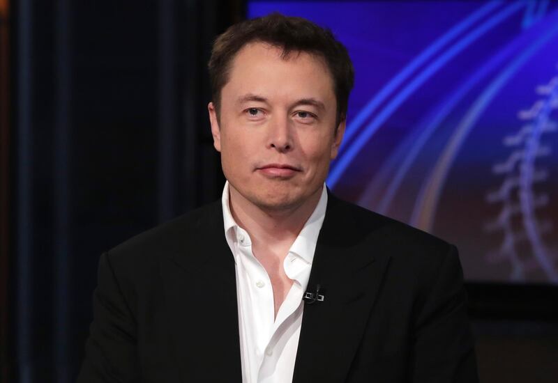 FILE - In this Wednesday, Sept. 17, 2014 file photo SpaceX billionaire founder and chief executive, and Tesla Motors CEO Elon Musk, is interviewed in New York. The billionaire's Boring Company tweeted Wednesday, Aug. 15, 2018, a proposal for autonomous, zero-emissions electric sleds that would run through a tunnel between the Dodger Stadium and a location in the city's Hollywood area. A proposal to build a gondola from Union Station to Dodger Stadium was announced in April. (AP Photo/Richard Drew, File)